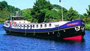 Scottish Hotel Barge SCOTTISH HIGHLANDER Caledonian Canal Loch Ness Scotland ParadiseConnections.com