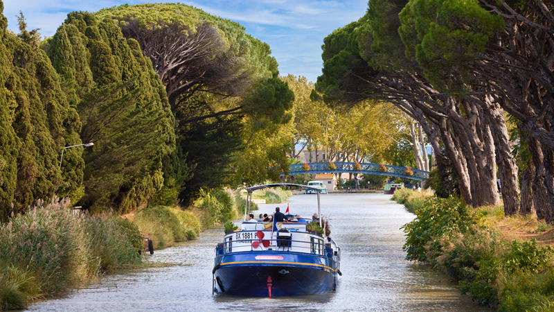 French hotel barge Anjodi cruising the canal du midi